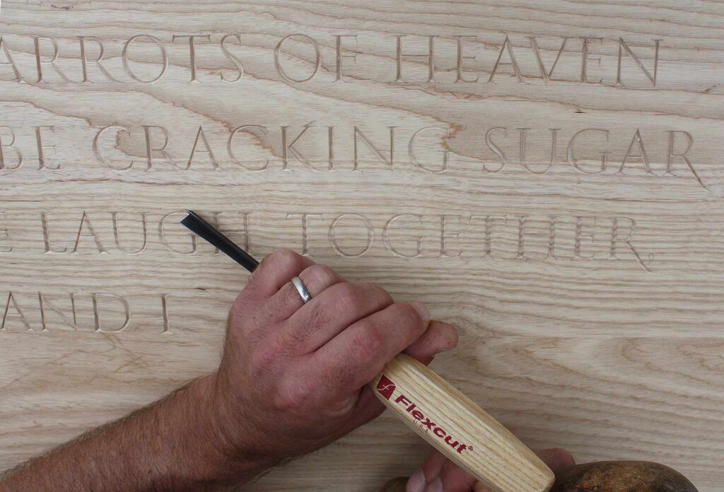 Carving Rumi poem into oak